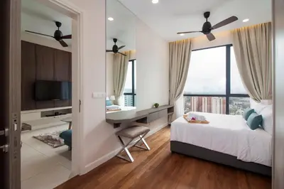 a bedroom with a desk and a bed with a desk at Nadi Bangsar by Plush in Kuala Lumpur