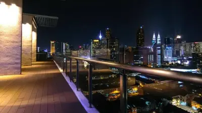 a view of a city skyline at night at Cozy Suites @ D’majestic Place, KL City Centre in Kuala Lumpur