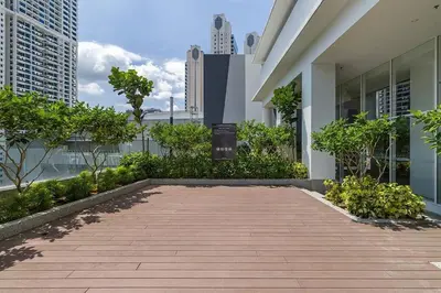 a walkway in front of a building with trees and buildings at SOGO PWTC KLCC Monorail link Quill Mall 7Pax in Kuala Lumpur