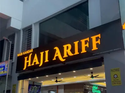 a sign on a building that reads haiti aire at Cozy 2-bed retreat - F&B Mart - Chan Sow Lin in Kuala Lumpur