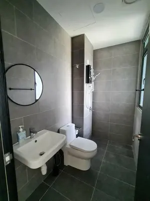 a bathroom with a white toilet and a sink at Studio Room near Gleneagles @ Embassy Row KLCC in Kuala Lumpur