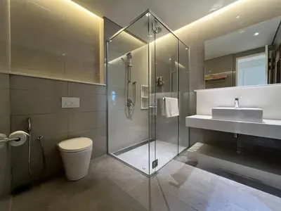 a bathroom with a shower and a toilet and a sink at Tribeca Residence Bukit Bintang in Kuala Lumpur