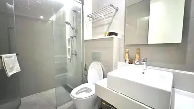 a bathroom with a toilet and a sink and a shower at Tribeca Residence Bukit Bintang in Kuala Lumpur