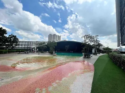a park with a fountain in the middle of a city at Arte Mont Kiara in Kuala Lumpur