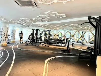 a gym with treadmills and machines in a building at Arte Mont Kiara in Kuala Lumpur