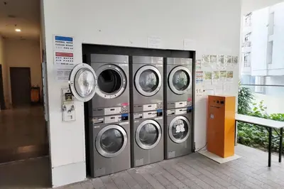a bunch of washing machines in a building at Spacious Home for 6pax - Regalia Suite - Infinity Pool with KL City View - Free Wi-Fi & Parking in Kuala Lumpur