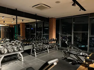 a gym with a lot of cardio equipment in a building at KLCC VIEW,5 mins to KL TOWER in Kuala Lumpur