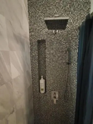 a bathroom with a shower with a shower head and a shower at Studio with an amazing view. 10 min to KLCC in Kuala Lumpur