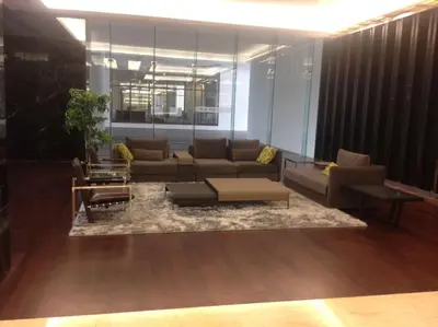 a living room with a couch and a table at Studio with an amazing view. 10 min to KLCC in Kuala Lumpur