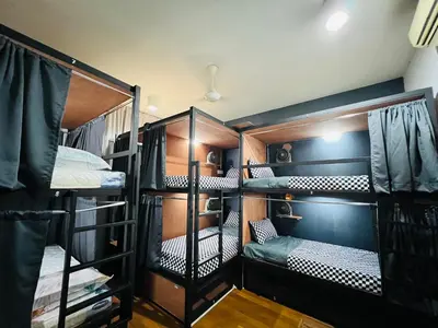 a room with four bunk beds in a room at Regalia Spritz Empire Hostel in Kuala Lumpur