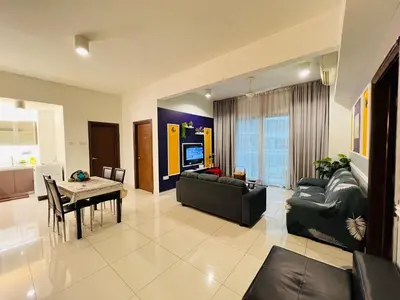 a living room with a couch and a table at Regalia Spritz Empire Hostel in Kuala Lumpur