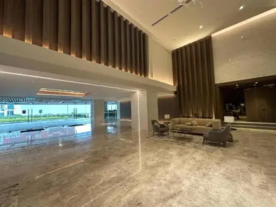 a lobby with a couch and chairs in a building at Quill Residences KlCC By G Z in Kuala Lumpur