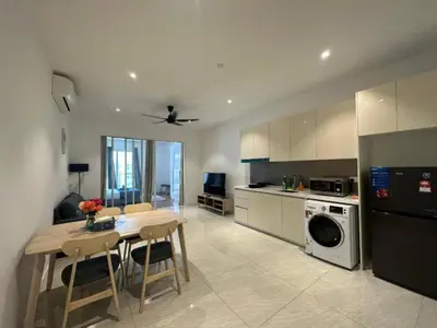 a kitchen with a table and a dining room at Quill Residences KlCC By G Z in Kuala Lumpur