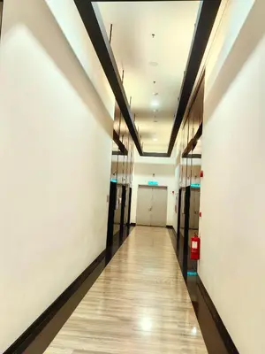 a hallway of an office building with a long corridor at Chambers Residence KLCC By Purple Orchid in Kuala Lumpur