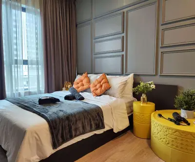 a bedroom with a bed with a teddy bear on it at Arte Plus Kuala Lumpur by Inn Lux in Kuala Lumpur