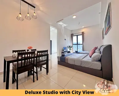 a bedroom with a bed and a table and a dining room at Trion @ Kuala Lumpur near KLCC TRX by Cityscape in Kuala Lumpur