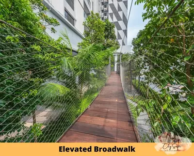 a walkway through a fence in a building at Trion @ Kuala Lumpur near KLCC TRX by Cityscape in Kuala Lumpur