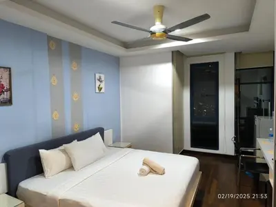 a bedroom with a bed with a ceiling fan at Sweet Home-0263A-Casa Residency in Kuala Lumpur