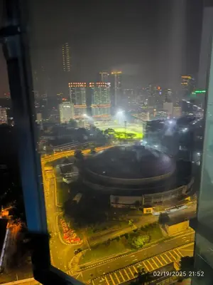 a view of a city at night with a building at Sweet Home-0263A-Casa Residency in Kuala Lumpur