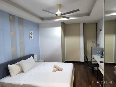 a bedroom with a white bed with a ceiling fan at Sweet Home-0263A-Casa Residency in Kuala Lumpur