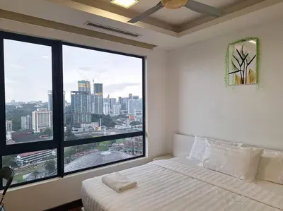 a bedroom with a bed and a large window at 026-3A Sweet Home-Casa Residency 2R 2B in Kuala Lumpur