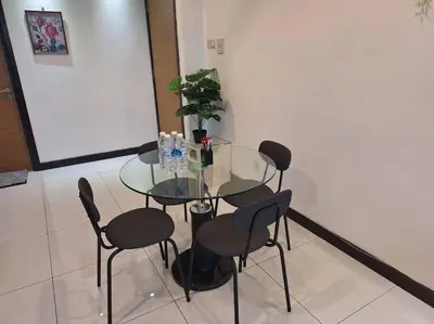 a glass table and chairs in a room at 026-3A Sweet Home-Casa Residency 2R 2B in Kuala Lumpur