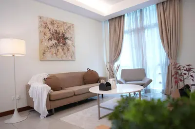 a living room with a couch and a table at 7 PAX, 1BR, 3mins to KLCC (3A3A) in Kuala Lumpur