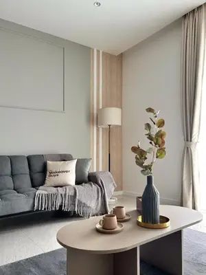 a living room with a couch and a table at Quill Residence Premium Cozy Suite By Ares Homestay in Kuala Lumpur