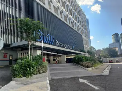 a building with a sign on the side of it at Quill Residence Premium Cozy Suite By Ares Homestay in Kuala Lumpur