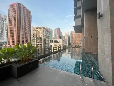 a swimming pool on the roof of a building at Anggun KL Mal in Kuala Lumpur