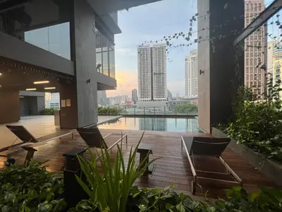 a patio with chairs and a pool in a building at Anggun KL Mal in Kuala Lumpur