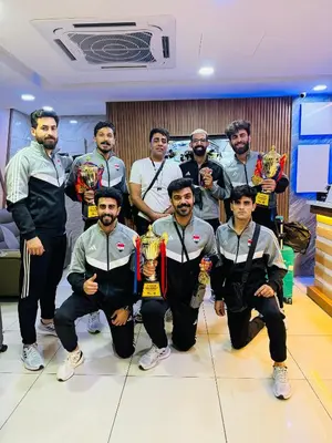 a group of men posing for a picture with their trophies at StarQ Hotel Bukit Bintang in Kuala Lumpur