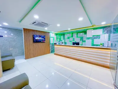 a restaurant lobby with a bar and a tv at StarQ Hotel Bukit Bintang in Kuala Lumpur