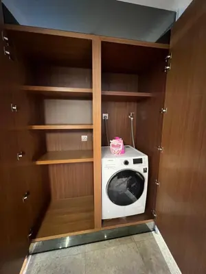 a small kitchen with a washer and dryer at Anggun KL MY in Kuala Lumpur