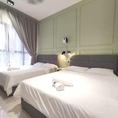 a hotel room with two beds and a window at TRION Studio 4 PAX Eleventen in Kuala Lumpur