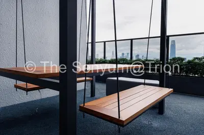 a wooden bench on the side of a building at TRION Studio 4 PAX Eleventen in Kuala Lumpur