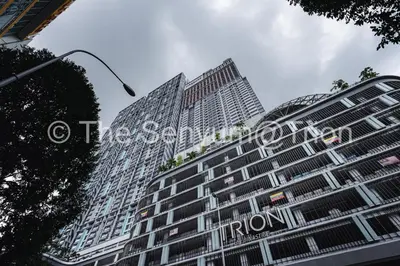a tall building with a sign on the side of it at TRION Studio 4 PAX Eleventen in Kuala Lumpur