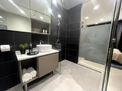 a bathroom with a sink and a shower at Novo KL, Astonishing Unique Executive Suite in Kuala Lumpur