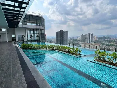 a swimming pool on the roof of a building at Novo KL, Astonishing Unique Executive Suite in Kuala Lumpur