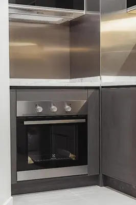 a kitchen with an oven in a kitchen at Novo Kuala Lumpur in Kuala Lumpur