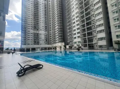 a swimming pool in front of some tall buildings at Sunset View at Modern Home in Kuala Lumpur