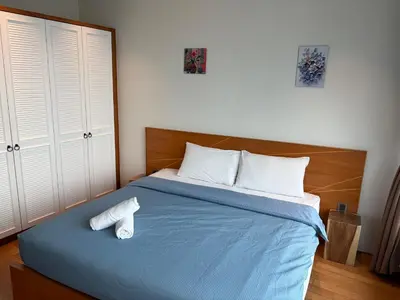 a bedroom with a bed with two towels on it at vortex klcc apartment by Dream NIGHT in Kuala Lumpur