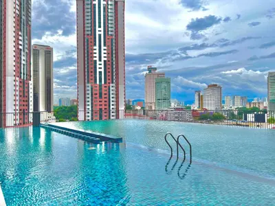 a large pool of water in a city with tall buildings at KL Chambers Suites BY Fortune in Kuala Lumpur