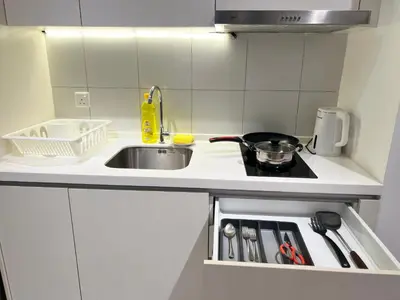 a small kitchen with a sink and a stove at KL Chambers Suites BY Fortune in Kuala Lumpur