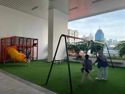 a group of children playing on a playground at KL Chambers Suites BY Fortune in Kuala Lumpur