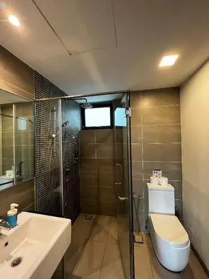 a bathroom with a shower and a toilet and a sink at Velocity Residence Suites By PSM in Kuala Lumpur