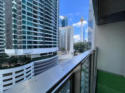 a balcony with a view of a city with tall buildings at 12mins walk to KLCC in Kuala Lumpur