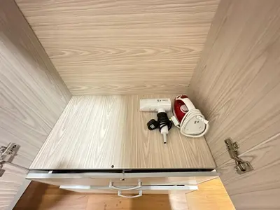 a room with a ceiling with a camera on a table at Sky Suites KL City Center in Kuala Lumpur