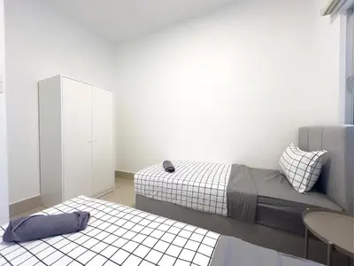 a bedroom with a bed and a cabinet and a table at Instaworthy 3B3B - 6 pax - F&B & Mart - Chan Sow Lin in Kuala Lumpur
