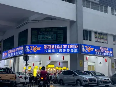 a gas station with cars parked in front of it at Instaworthy 3B3B - 6 pax - F&B & Mart - Chan Sow Lin in Kuala Lumpur